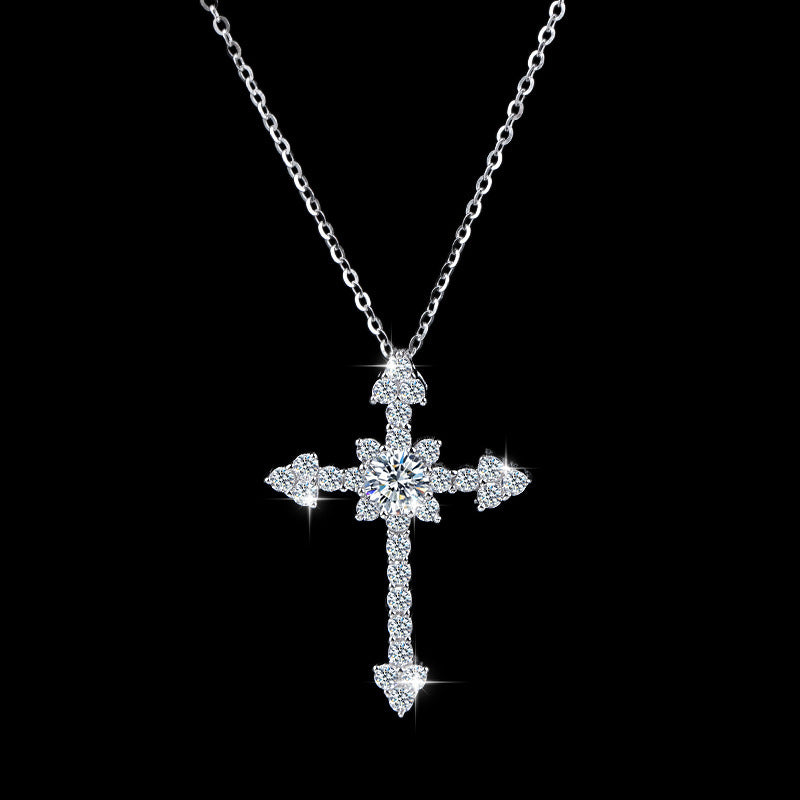 Moissanite cross necklace on a velvet box
