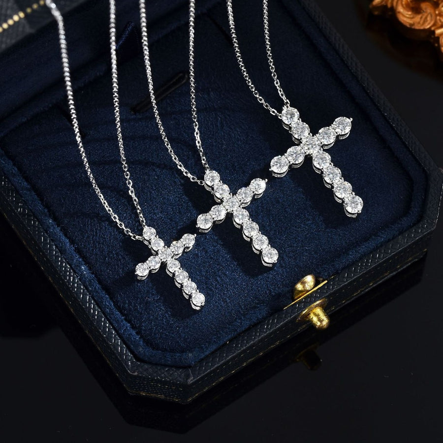 Moissanite cross necklace on a velvet box