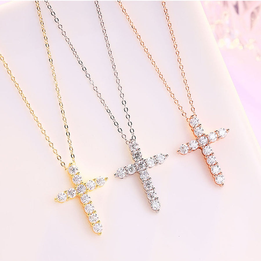 Moissanite cross necklace on a velvet box