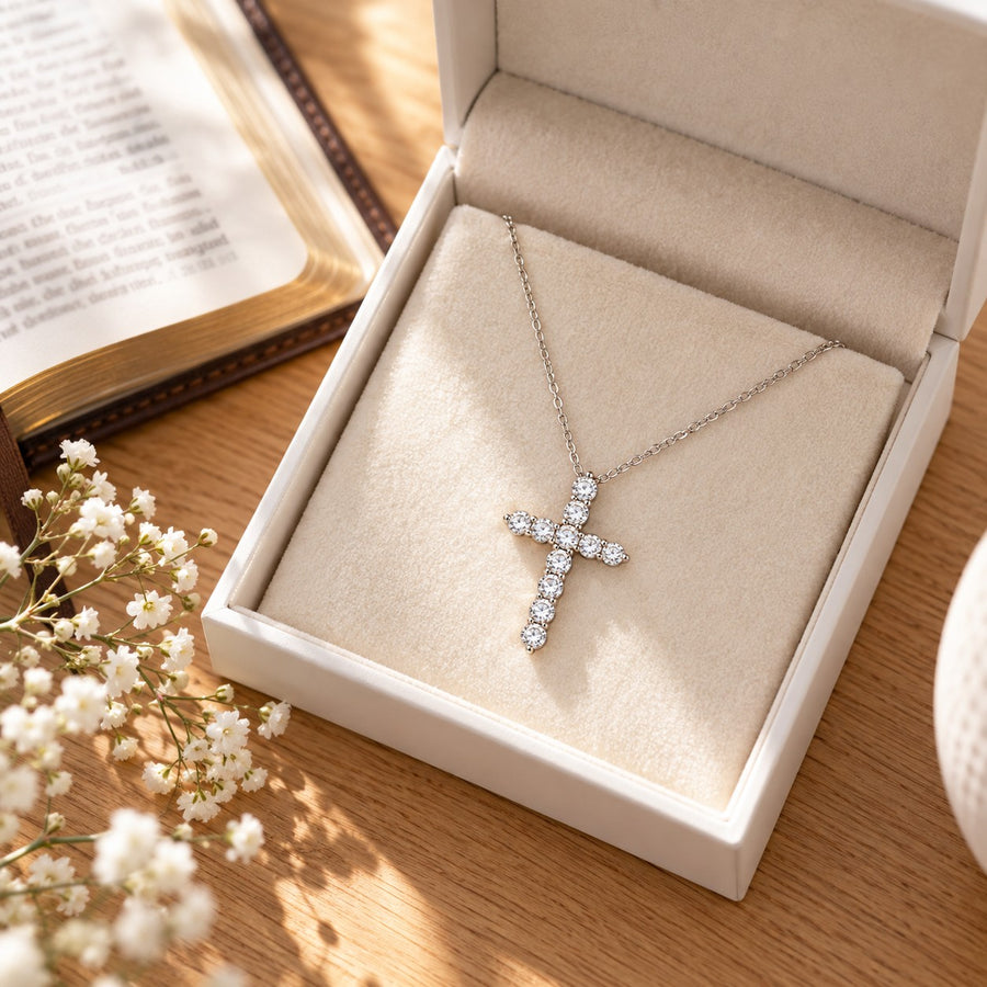 Moissanite cross necklace on a velvet box