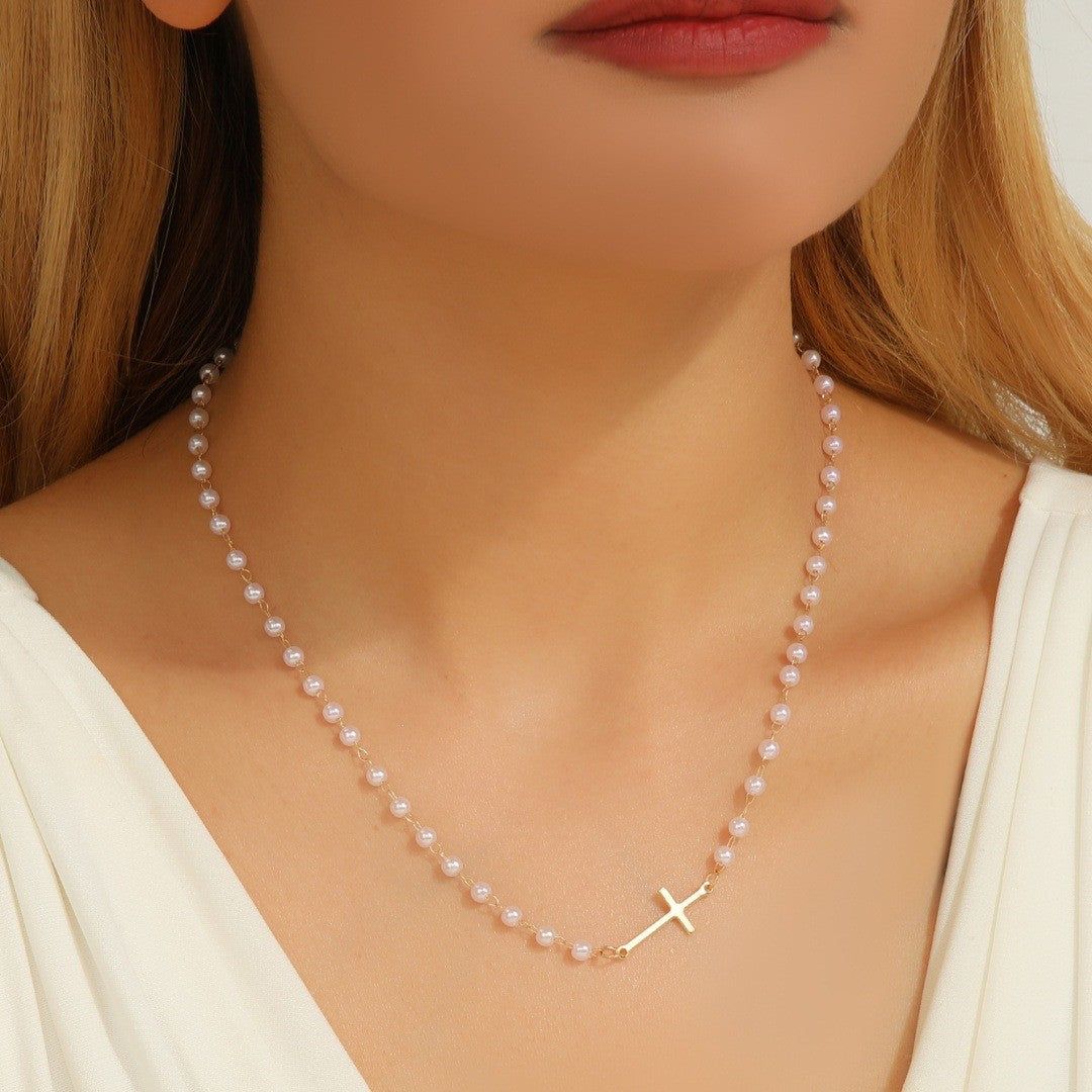Pearl cross necklace with sideways cross